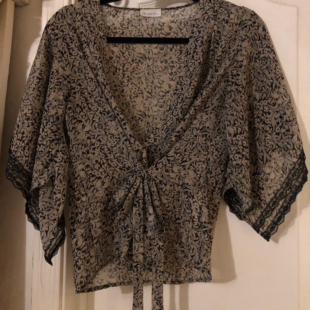 Light taupe color dainty print & black accents.